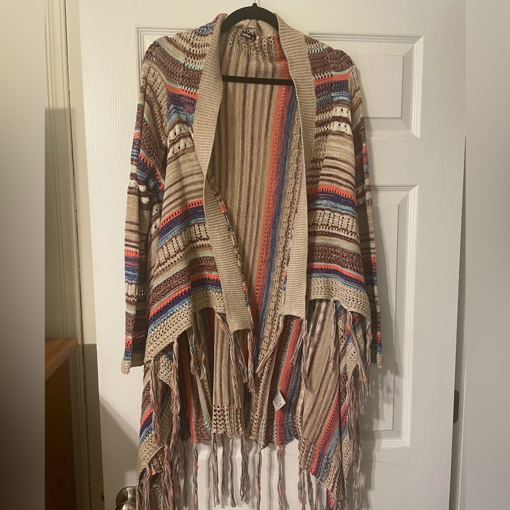 Multi-colored fringed sweater.